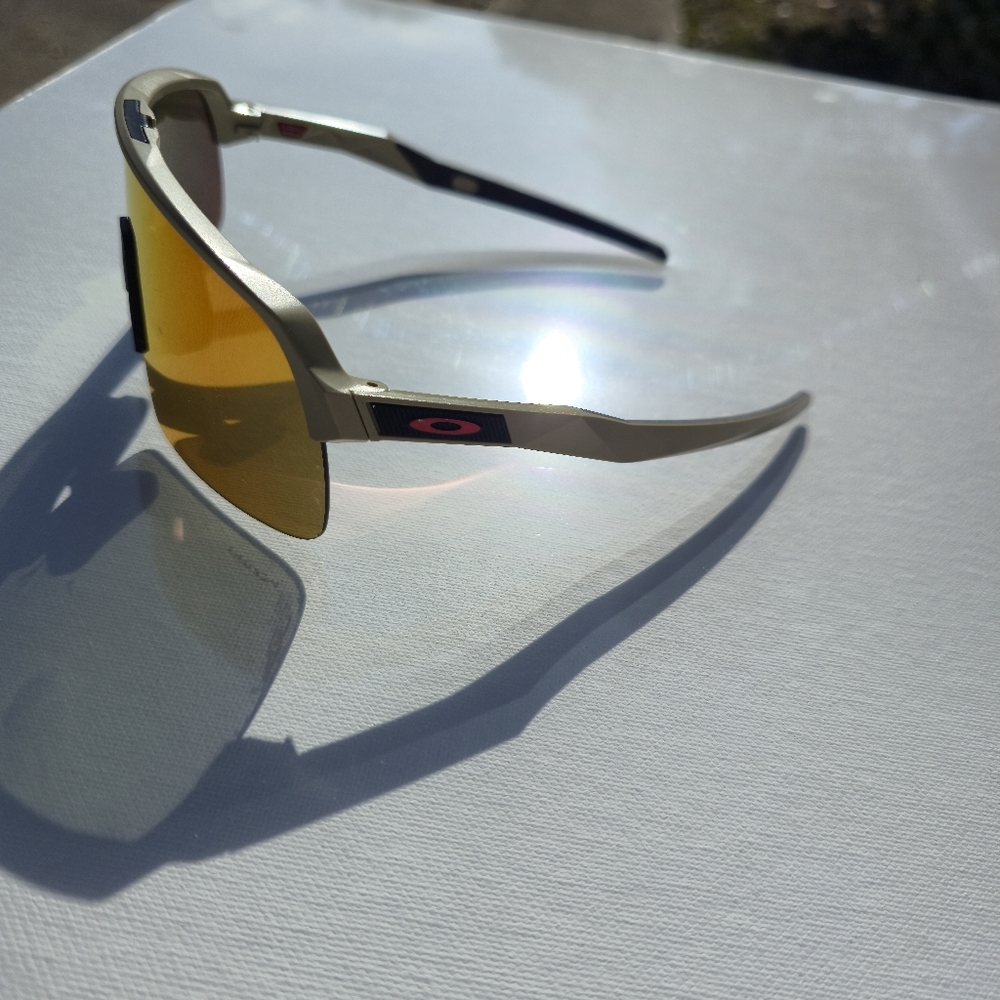Oakley Sunglasses with Red Lens and Beige Accents - Picture 3 of 4